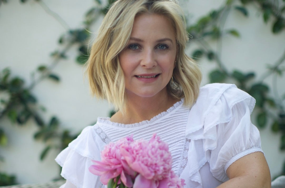 Jessica Capshaw holding flowers